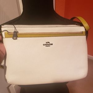 Gently used lime/off white Coach purse with detachable wallet